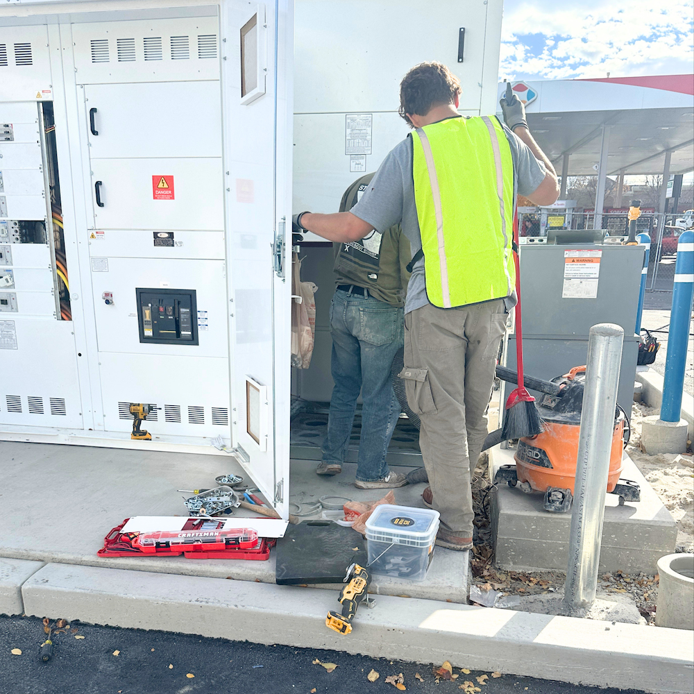O'Bray Electric technician servicing a commercial generator and panel in Utah
